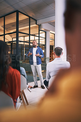 Buy stock photo Shot of a group of businesspeople attending a conference at work
