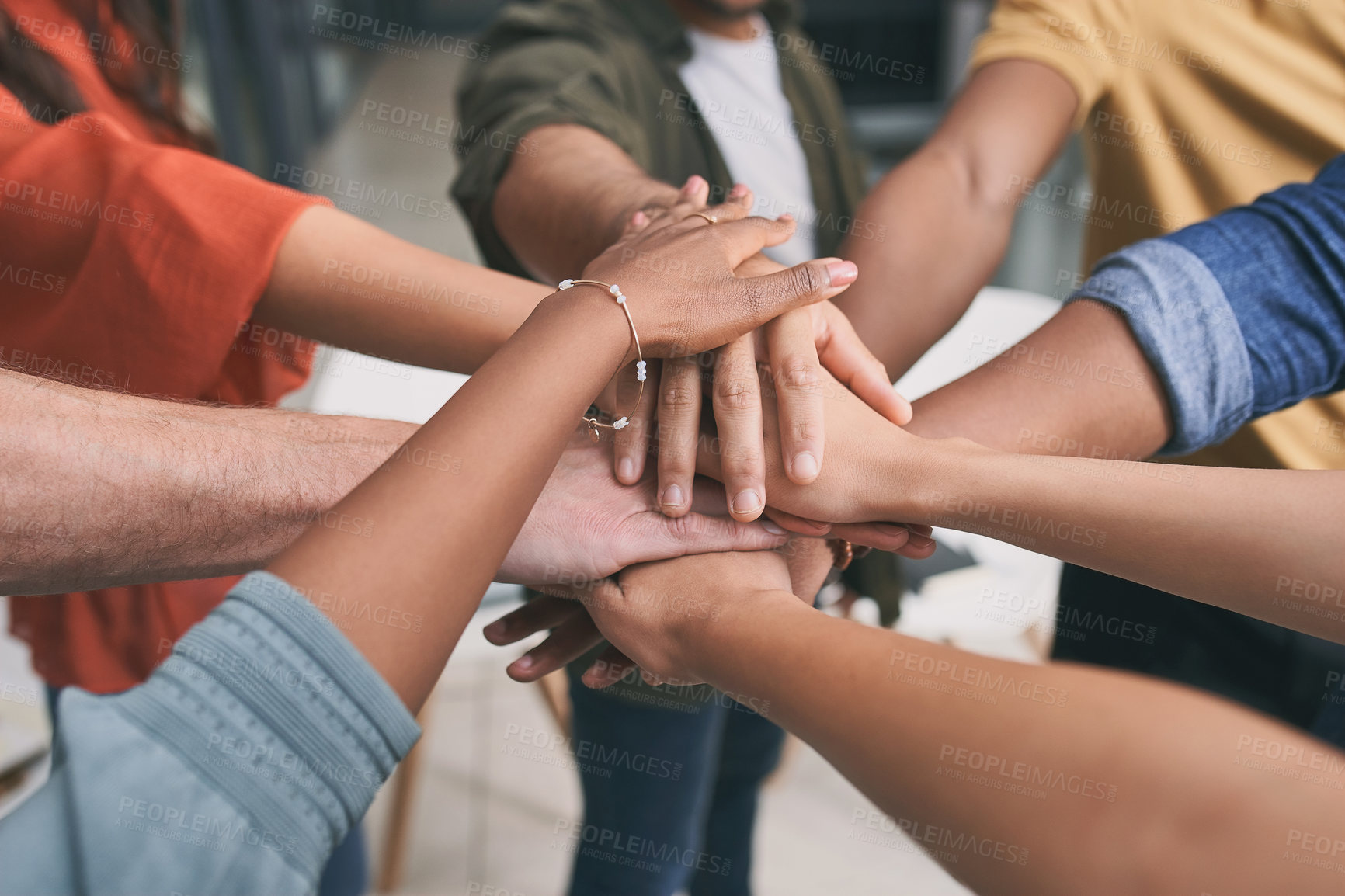 Buy stock photo Shot of a unrecognizable team of business people stacking their hands in motivation