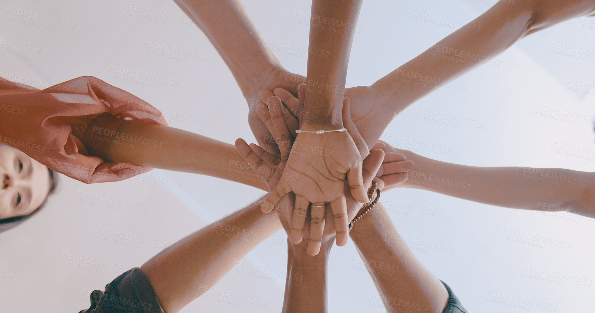 Buy stock photo Shot of a team of business people stacking their hands in motivation