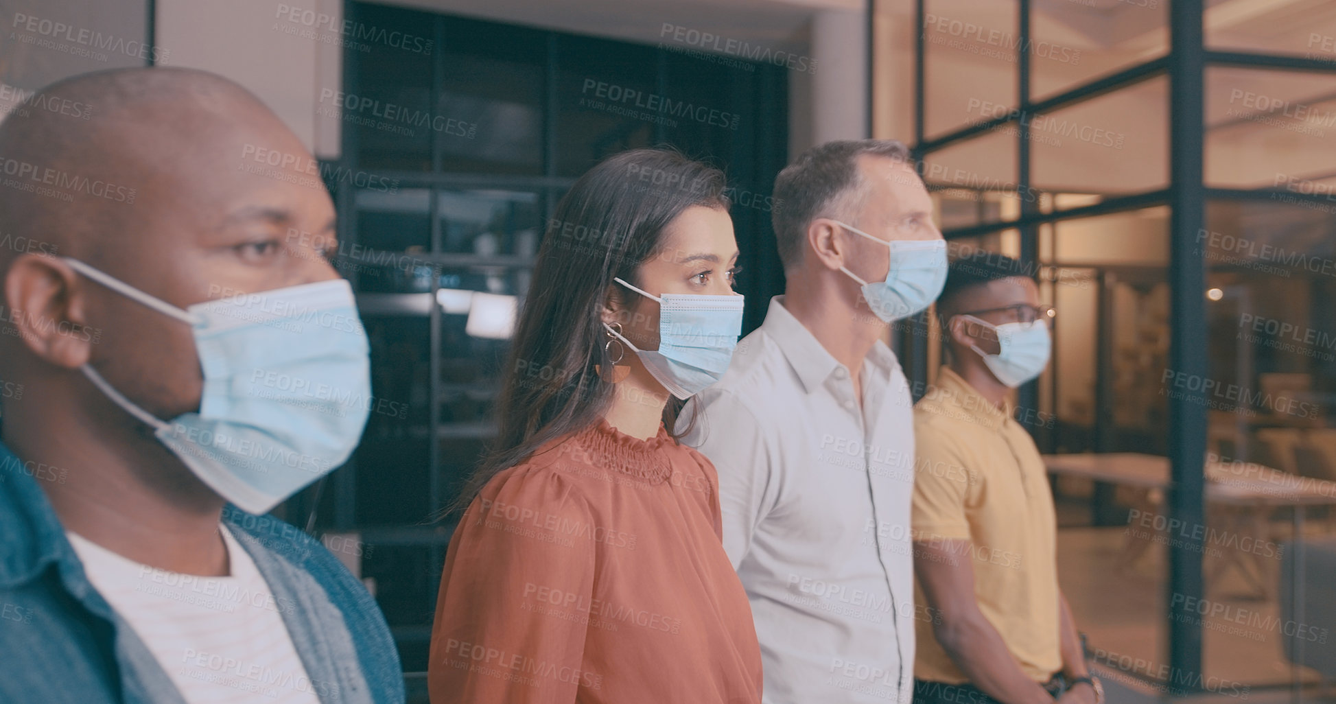 Buy stock photo Shot of a team of coworkers in their office during lockdown