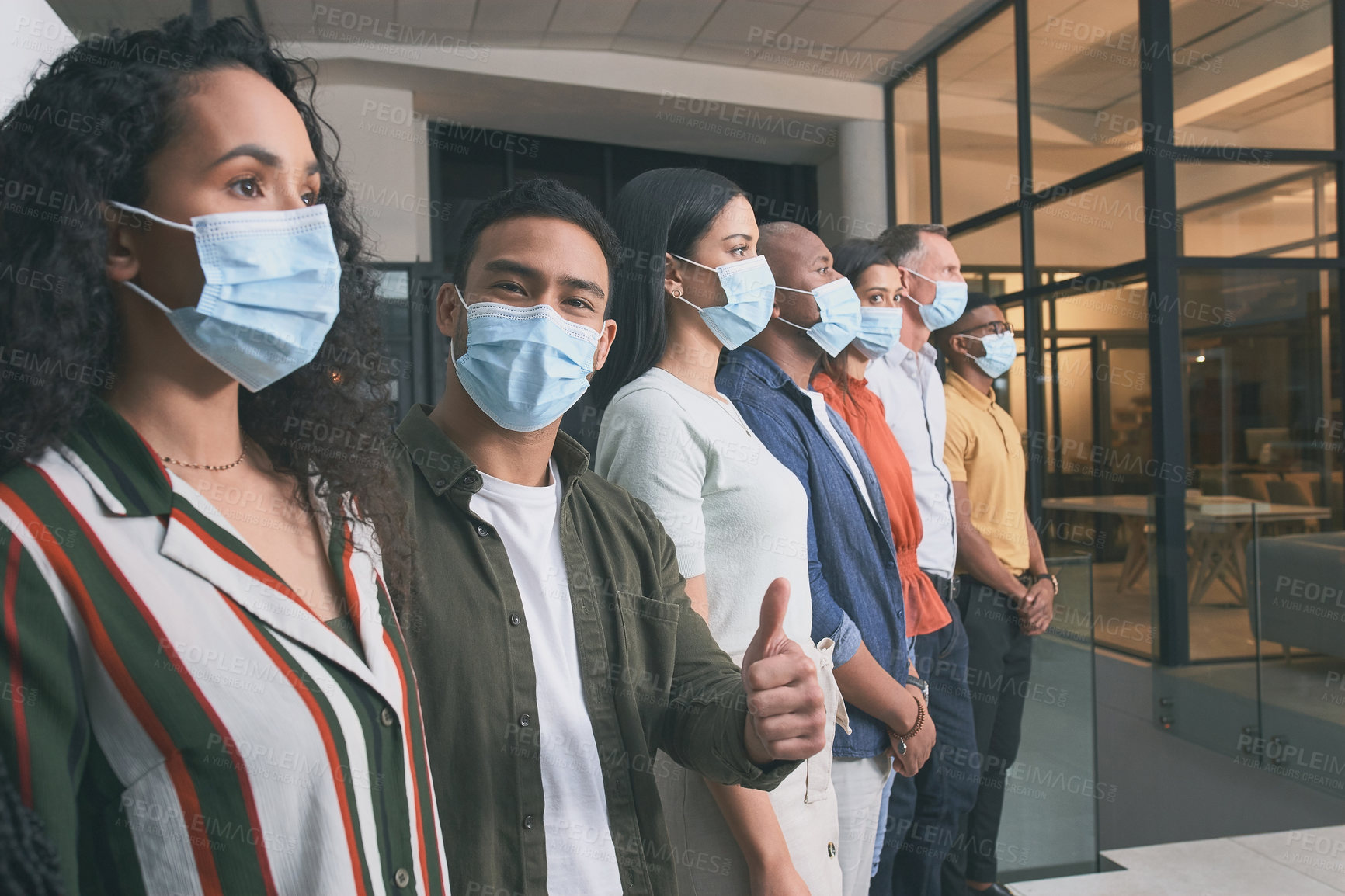 Buy stock photo Shot of a team of colleagues giving the thumbs up