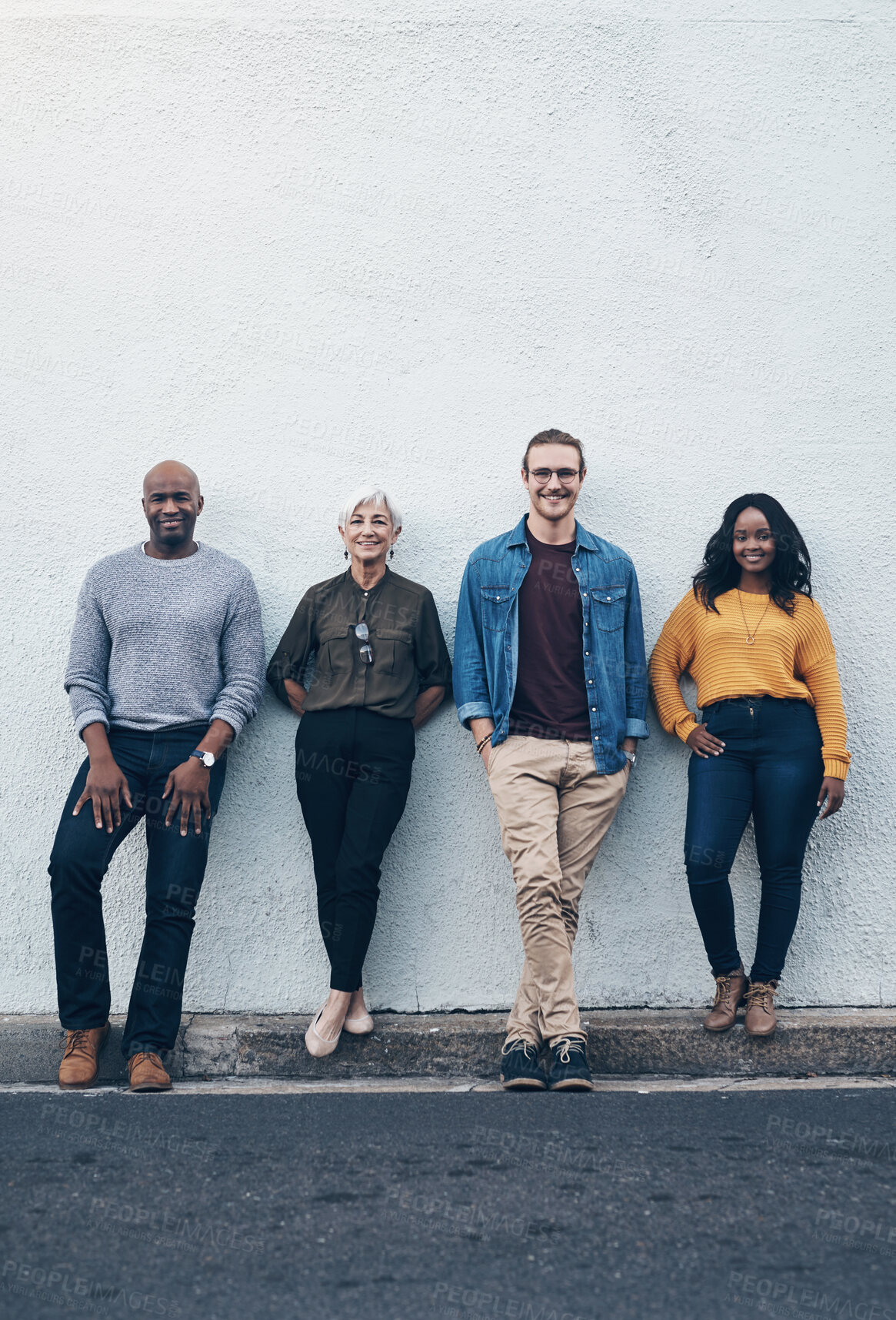 Buy stock photo Happy, team and portrait of business people by wall for partnership, confidence and collaboration. Creative employees, diversity or smile for urban city, development and opportunity by mockup outdoor