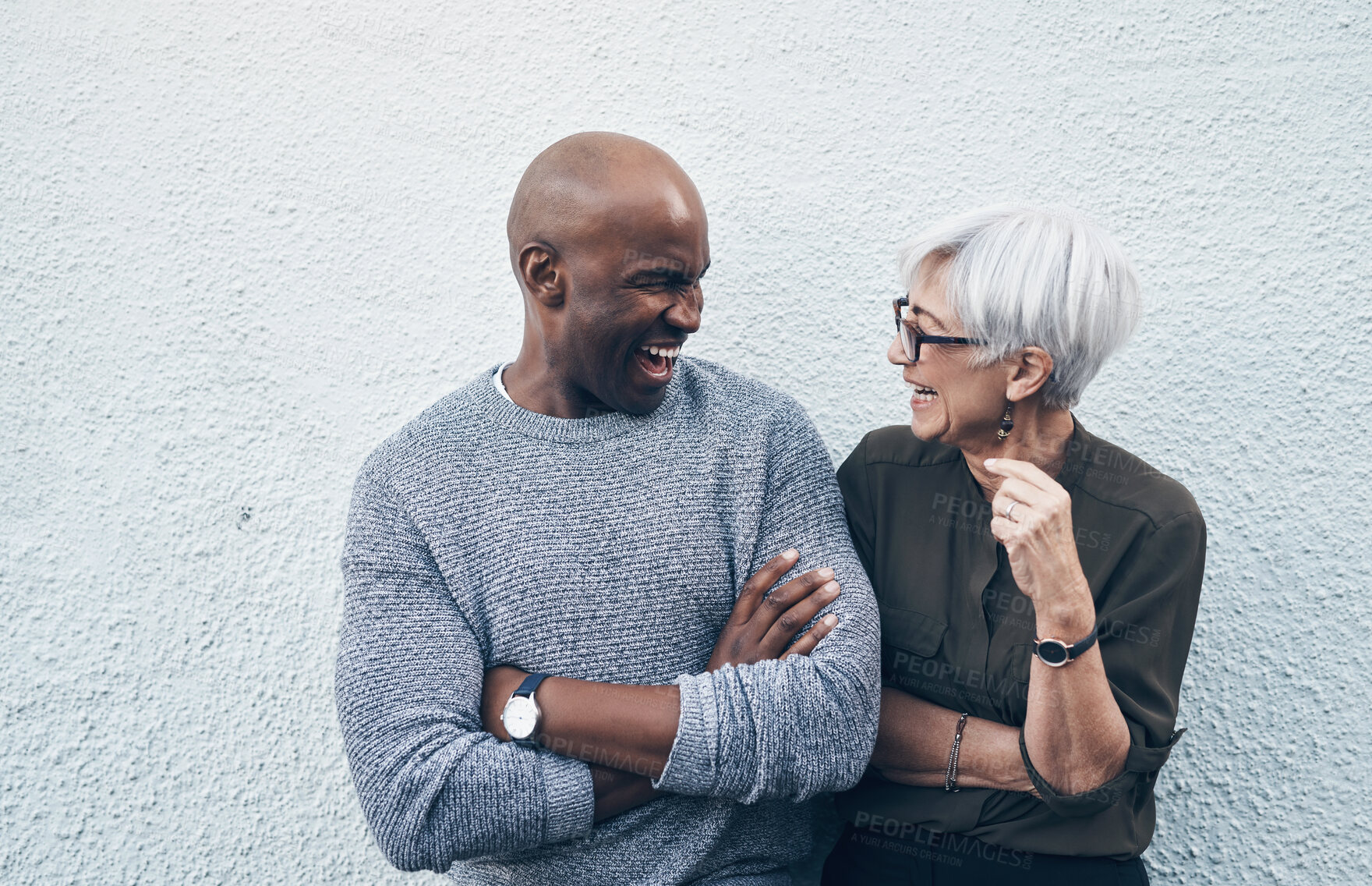 Buy stock photo Senior, creative and professional with wall in white background talk about collaboration for business. Employee, conversation and outdoor about teamwork with smile for working on startup as career.