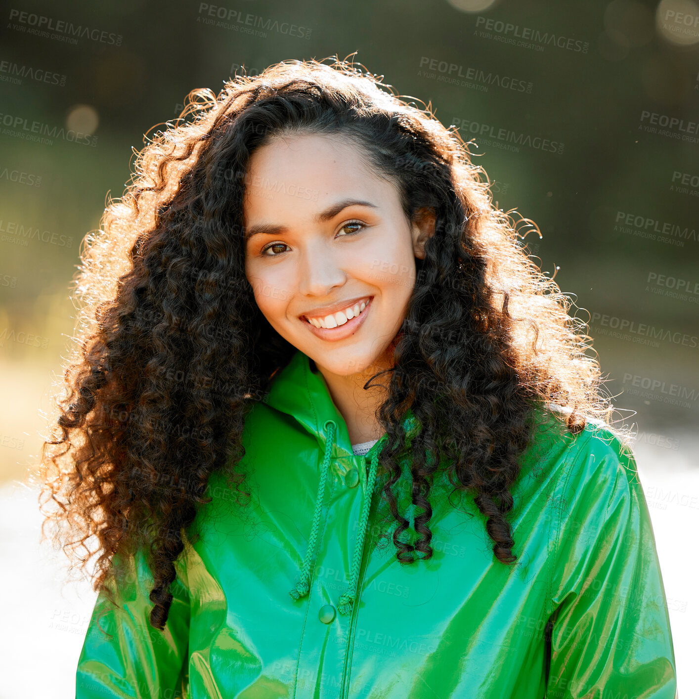 Buy stock photo Shot of a beautiful young woman spending a day outside in the rain