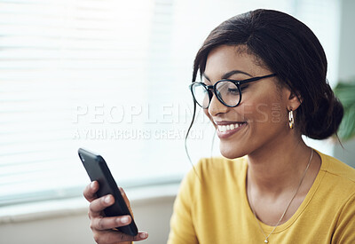 Buy stock photo Phone, typing and happy woman reading online, social media post or networking on internet for job search. Creative, communication and african person in glasses, texting on mobile app or chat at home