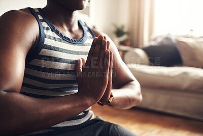 Buy stock photo Closeup shot of an unrecognisable man meditating at home