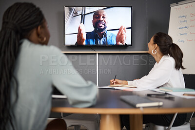 Buy stock photo Shot of a group of businesspeople having a video conference in an office