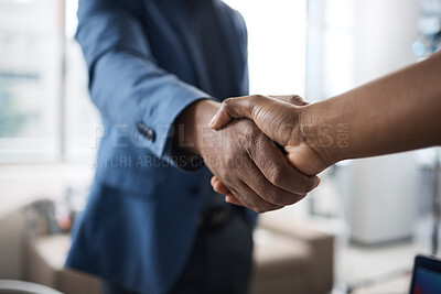 Buy stock photo Closeup shot of two unrecognisable businesspeople shaking hands in an office