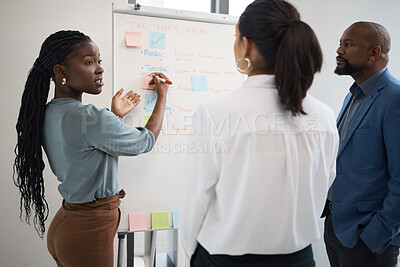 Buy stock photo Black woman, business schedule and whiteboard writing for company planning with sticky notes. African female employee, startup meeting and collaboration of staff working with teamwork or conversation