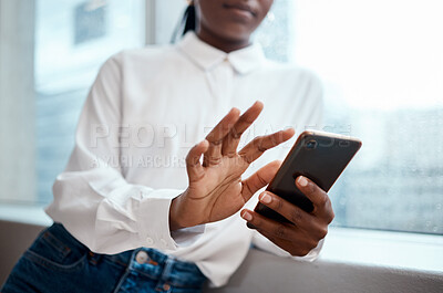 Buy stock photo Cropped shot of a businesswoman using her cellphone
