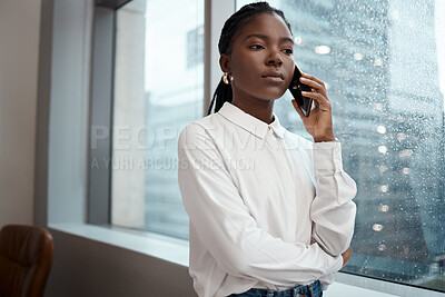 Buy stock photo Shot of a businesswoman talking on her cellphone