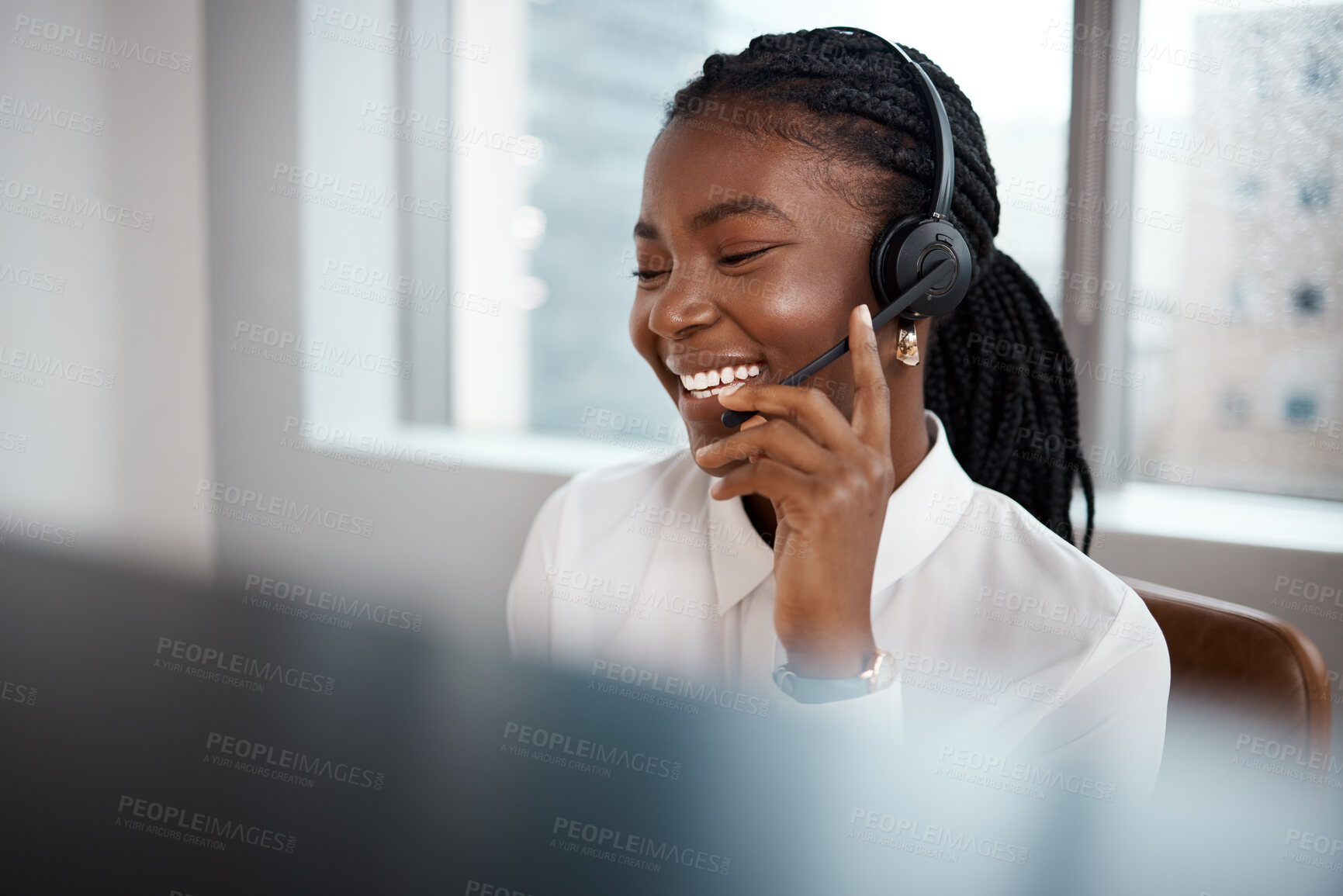 Buy stock photo Shot of a call center agent working at her desk