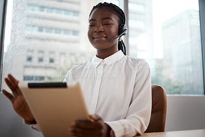 Buy stock photo Shot of a woman using a digital tablet while working in a call center