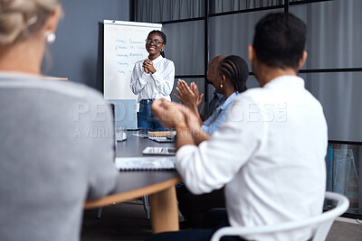 Buy stock photo Shot of a group of businesspeople clapping hands in a meeting at work