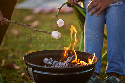 Buy stock photo People, toasting and marshmallow by fire on camping in forest with love or bonding for adventure. Man, woman and smores with grill for dessert by flame in nature on vacation for memories on picnic