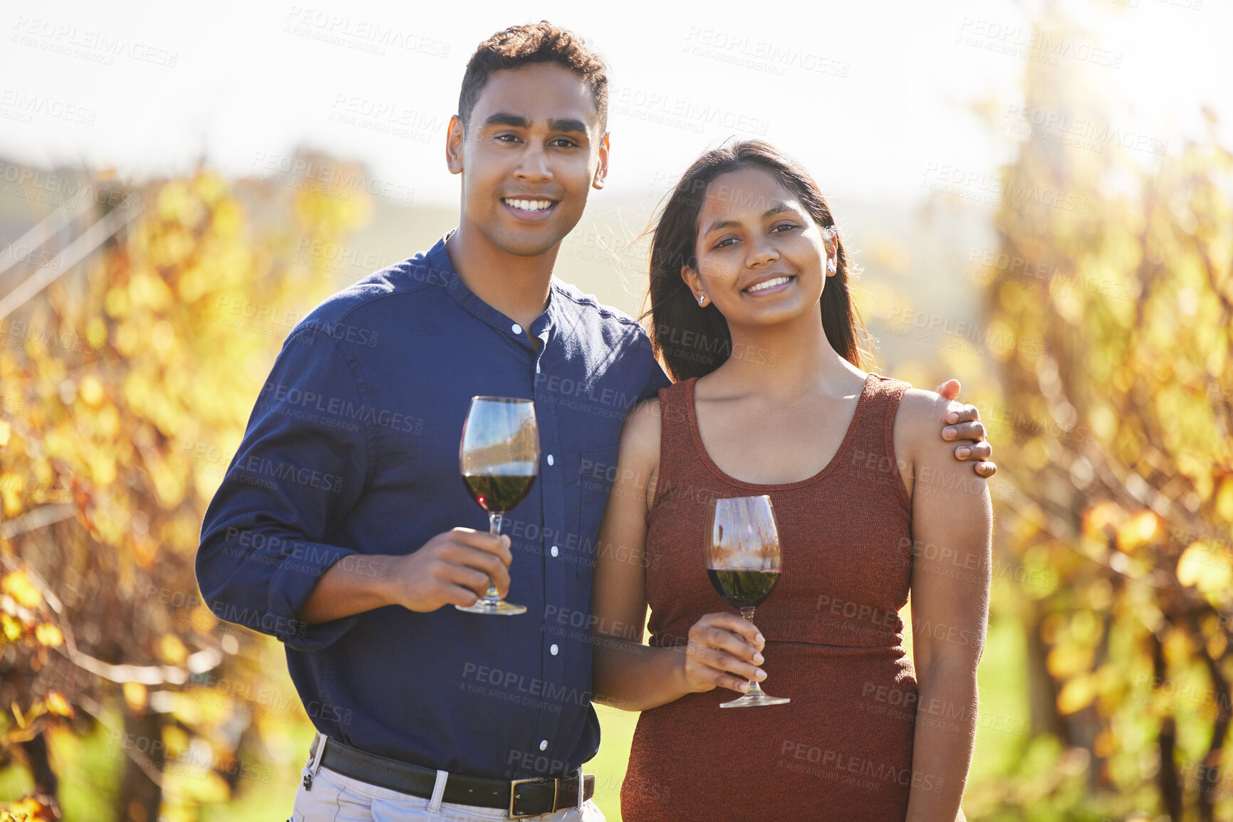 Buy stock photo Couple, portrait and happy at vineyard with glass for wine tasting, hug and vacation in countryside. Man, woman and smile with drink, alcohol and date at farm in summer for holiday in California