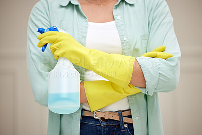 Buy stock photo Shot of a woman holding a spray bottle about to clean