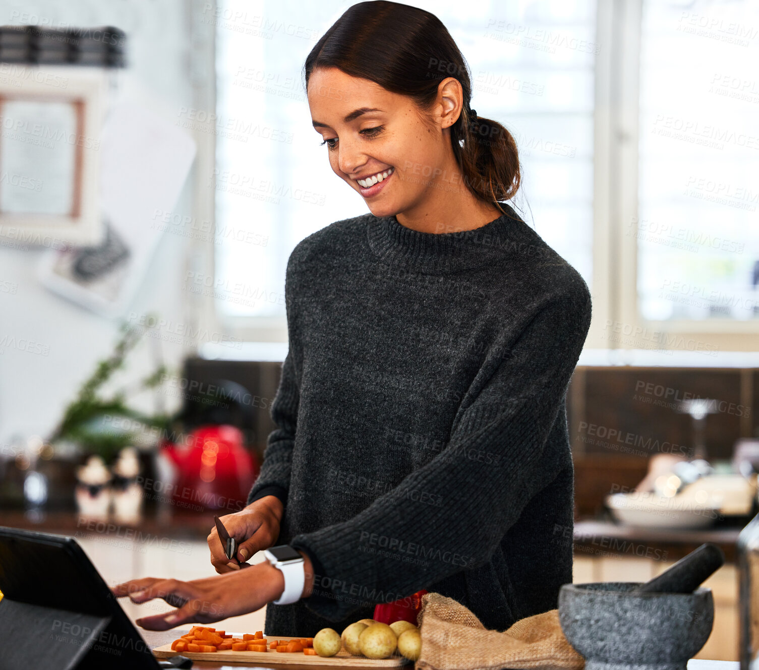 Buy stock photo Woman, smile and cooking in kitchen with tablet for online recipe, explanation video and research at home. Female person, happy and food with technology for meal prep, blog and digital information