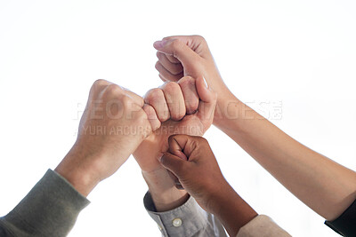 Buy stock photo Teamwork, hand and fist together in studio, diversity and solidarity or business people or corporate employees. Team building, celebration for target goal or support, inclusion and united in work