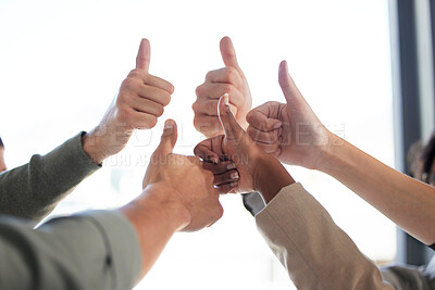 Buy stock photo Shot of a group of unrecognizable businesspeople showing the thumbs up against a white background