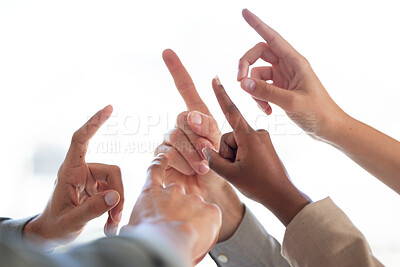 Buy stock photo Shot of a group of unrecognizable businesspeople joining their fingers up against a white background