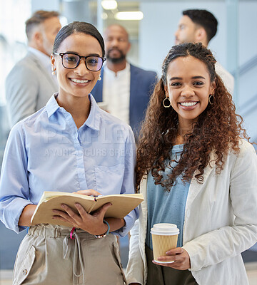 Buy stock photo Portrait of two businesswomen standing in an office with their colleagues in the background