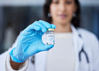 Buy stock photo Shot of a woman holding a vaccine