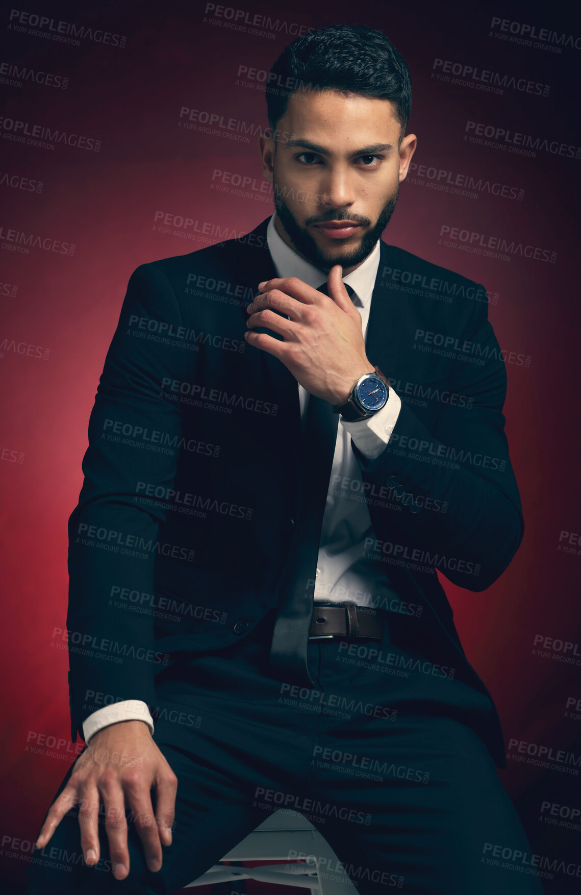 Buy stock photo Young man, suit and studio portrait with business fashion, dark and mysterious aesthetic by red background. Businessman, formal and professional clothes with entrepreneurship, career and backdrop