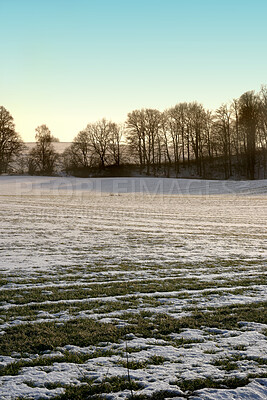 Buy stock photo A photo of a winter landscape at sunset