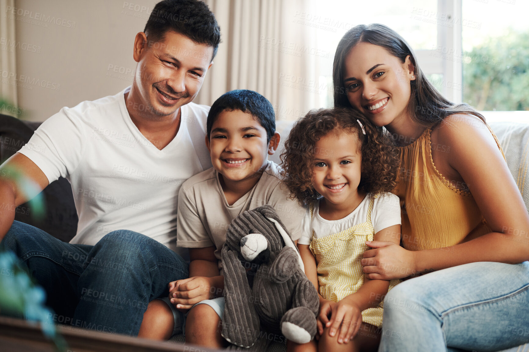 Buy stock photo Family, portrait and relax with smile on sofa for bonding with affection, safety and security for children with love. Mother, father and siblings in living room of home together with protection.