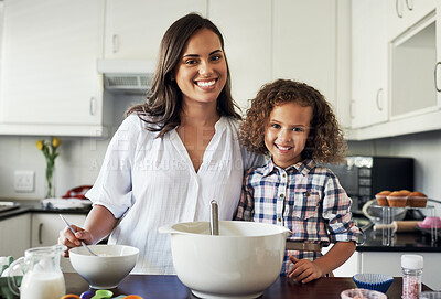 Buy stock photo Portrait of an adorable little girl baking with her mom at home