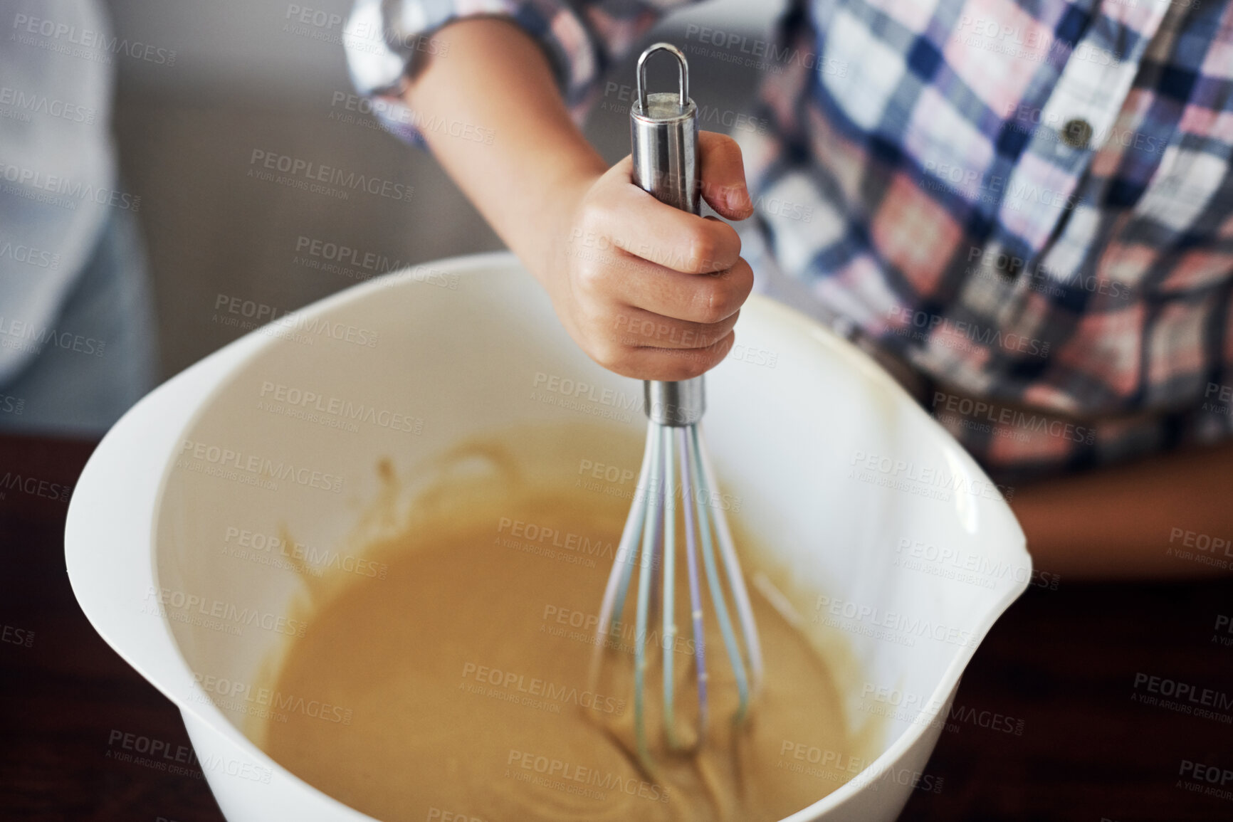 Buy stock photo Child, hands and bowl for baking, mixing and learning in kitchen with ingredients, cake or dessert preparation. Kid at home with whisk and cooking, helping or bonding with family for holiday cookies