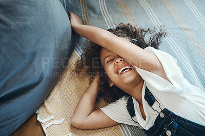 Buy stock photo Adorable, girl and fun on floor, laughing and energy for playing, living room and relax in weekend. House, happiness and child on ground, healthy and smile on mat, kid and joy home, lounge and youth