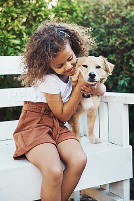 Buy stock photo Shot of a little girl spending time with her pet dog