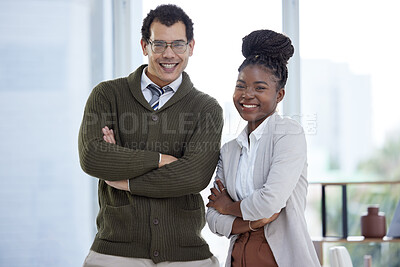 Buy stock photo Portrait of two businesspeople standing together with their arms crossed in an office