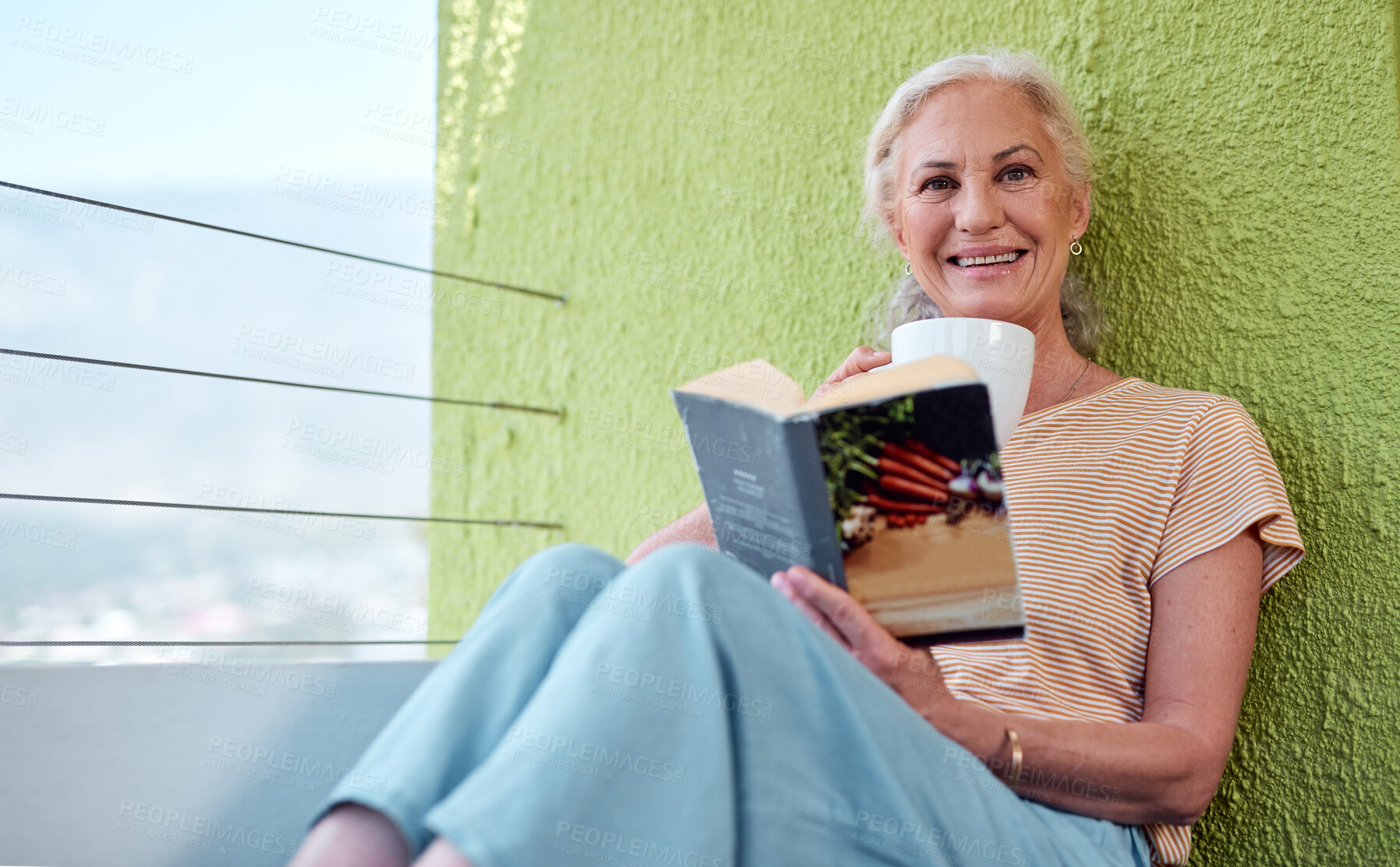 Buy stock photo Senior woman, outdoor portrait and reading book with calm weekend, alone time and coffee cup in home. Elderly person, literature and relax on balcony in morning with retirement, espresso and story