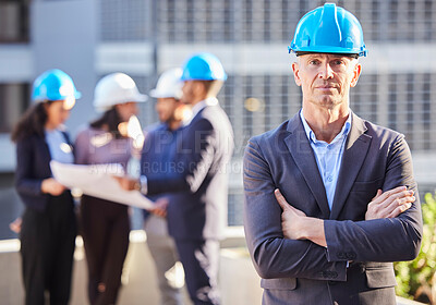 Buy stock photo Businessman, portrait and architect with arms crossed in project management, leadership or construction on site. Confident man, engineer or manager with hard hat and team for industrial architecture