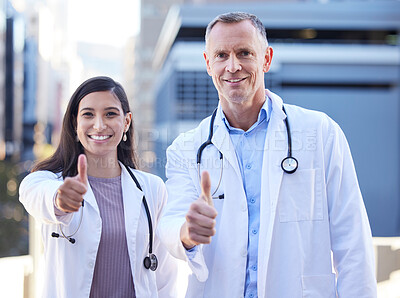 Buy stock photo Doctors, portrait and thumbs up for medical healthcare by hospital building, approval or agreement. Man, woman and face for happy teamwork or wellness support for insurance trust, goals or service