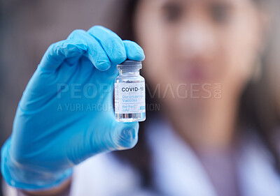 Buy stock photo Doctor, covid vaccine and medicine in hand for corona virus in a hospital lab for healthcare and healing. Woman or medical worker with bottle of liquid or pharmaceutical product for safety and health