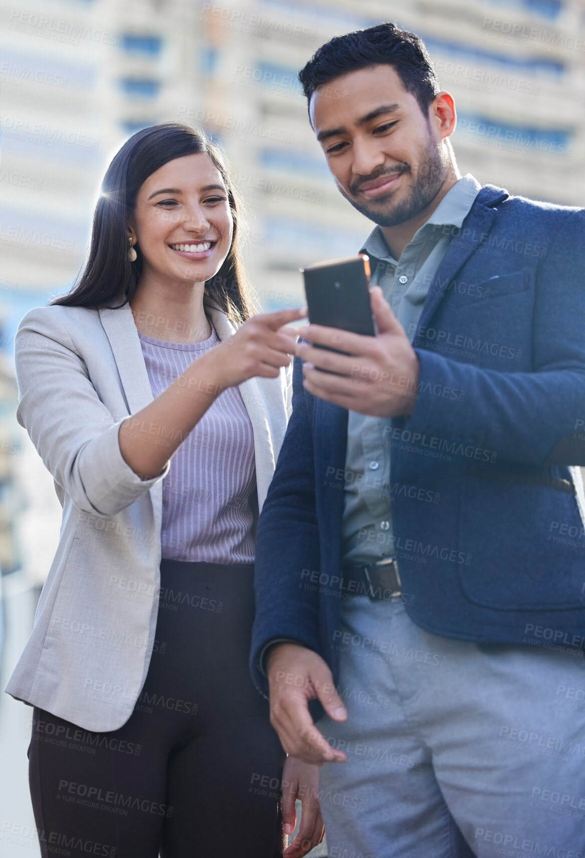 Buy stock photo Phone, business people and team outdoor in a city with internet connection for social media. A happy man and woman together on urban background with smartphone for networking, communication or app
