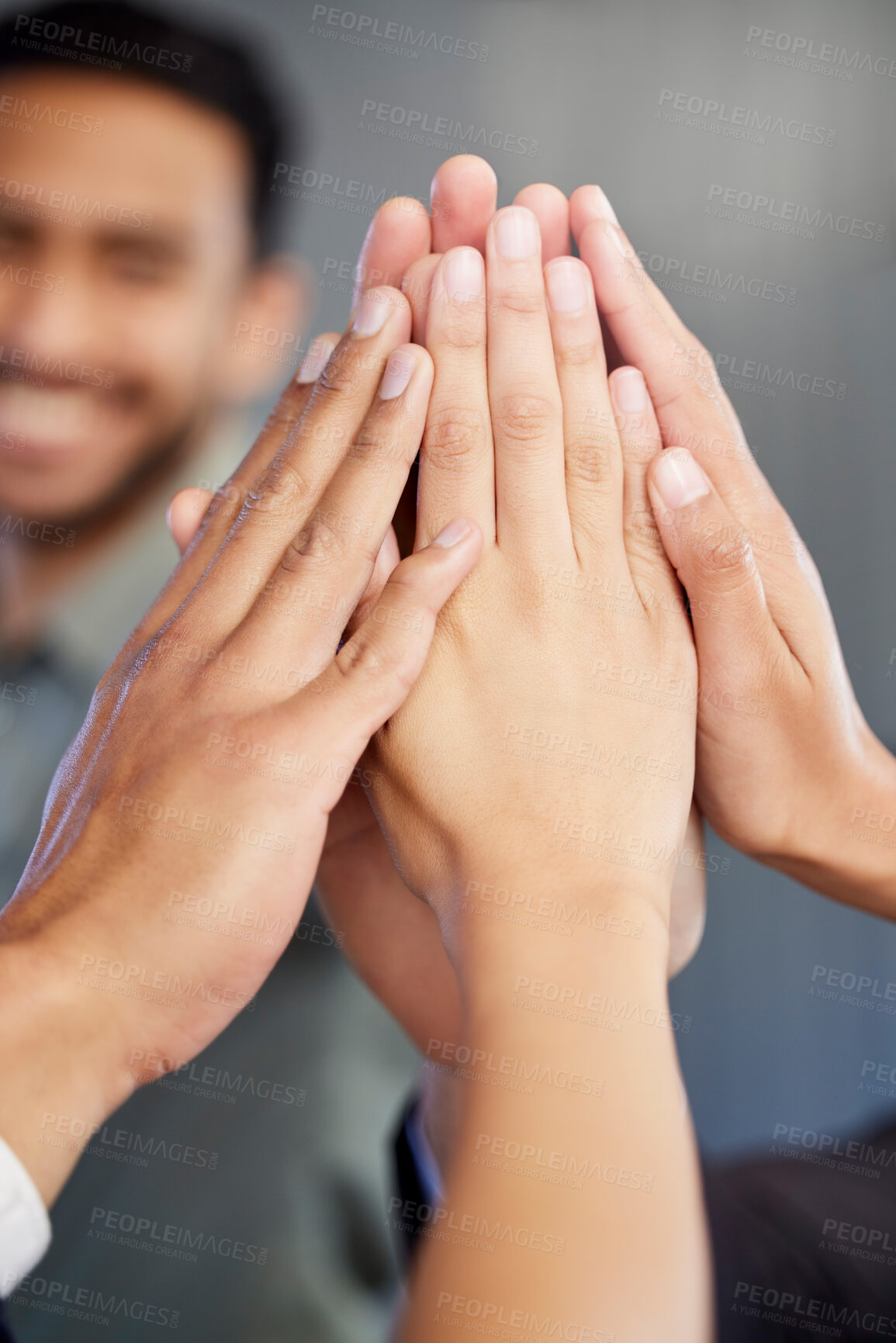 Buy stock photo Closeup shot of a group of unrecognisable businesspeople giving each other a high five in an office