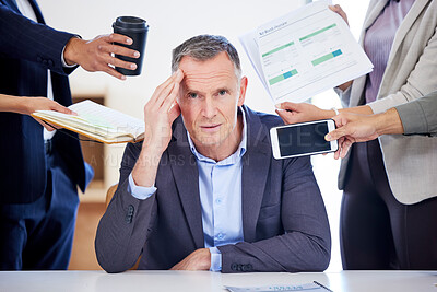 Buy stock photo Portrait of a mature businessman looking stressed out in a demanding office environment