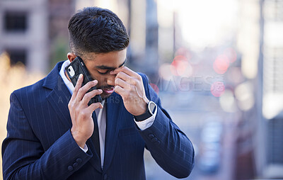 Buy stock photo Shot of a young man on a call in the city