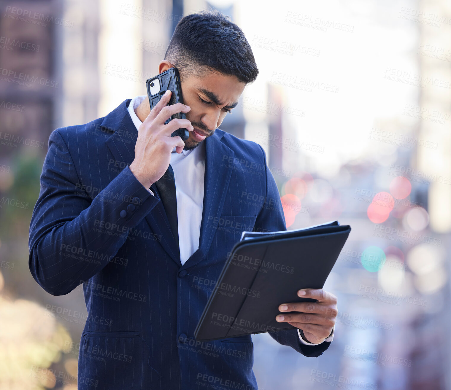 Buy stock photo Businessman, reading and city with document and phone call for thoughts on ideas, planning and work. Male employee, outdoor and smartphone for communication in Dubai and business conversation.