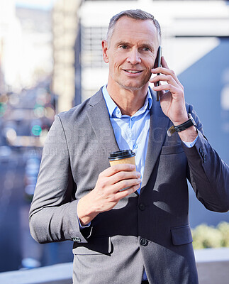 Buy stock photo Shot of a young man on a call in the city