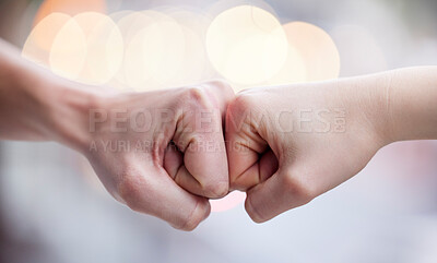 Buy stock photo Shot of two unrecognizable people fist bumping