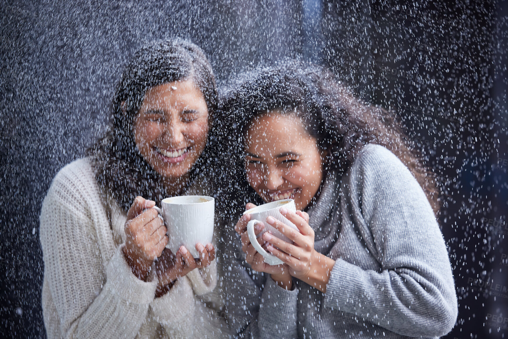 Buy stock photo Shot of two best friends standing outside in the snow during Christmas while holding coffee mugs
