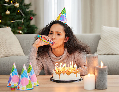 Buy stock photo Woman, celebrate and unhappy birthday in home, sad and grief for turning older with cake and candles in festive season. Depressed, loneliness and decorations for holiday blues, party hat and upset