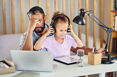 Buy stock photo Shot of a little girl interrupting her father while he works