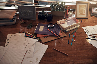 Buy stock photo Shot of various school related items on a desk at home